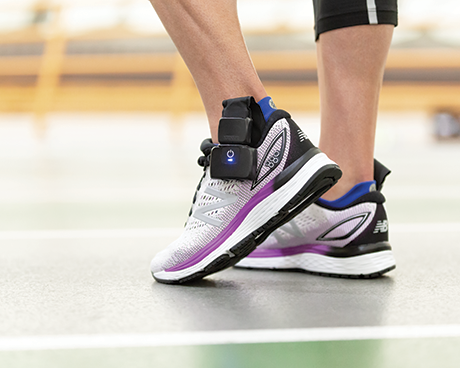 Athlete wearing XSENSOR's Intelligent Insoles in their shoes.