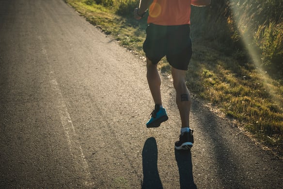 Person running away from camers with insole pressure sensors in their shoes.