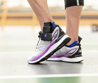 Athlete wearing XSENSOR's Intelligent Insoles in their shoes.